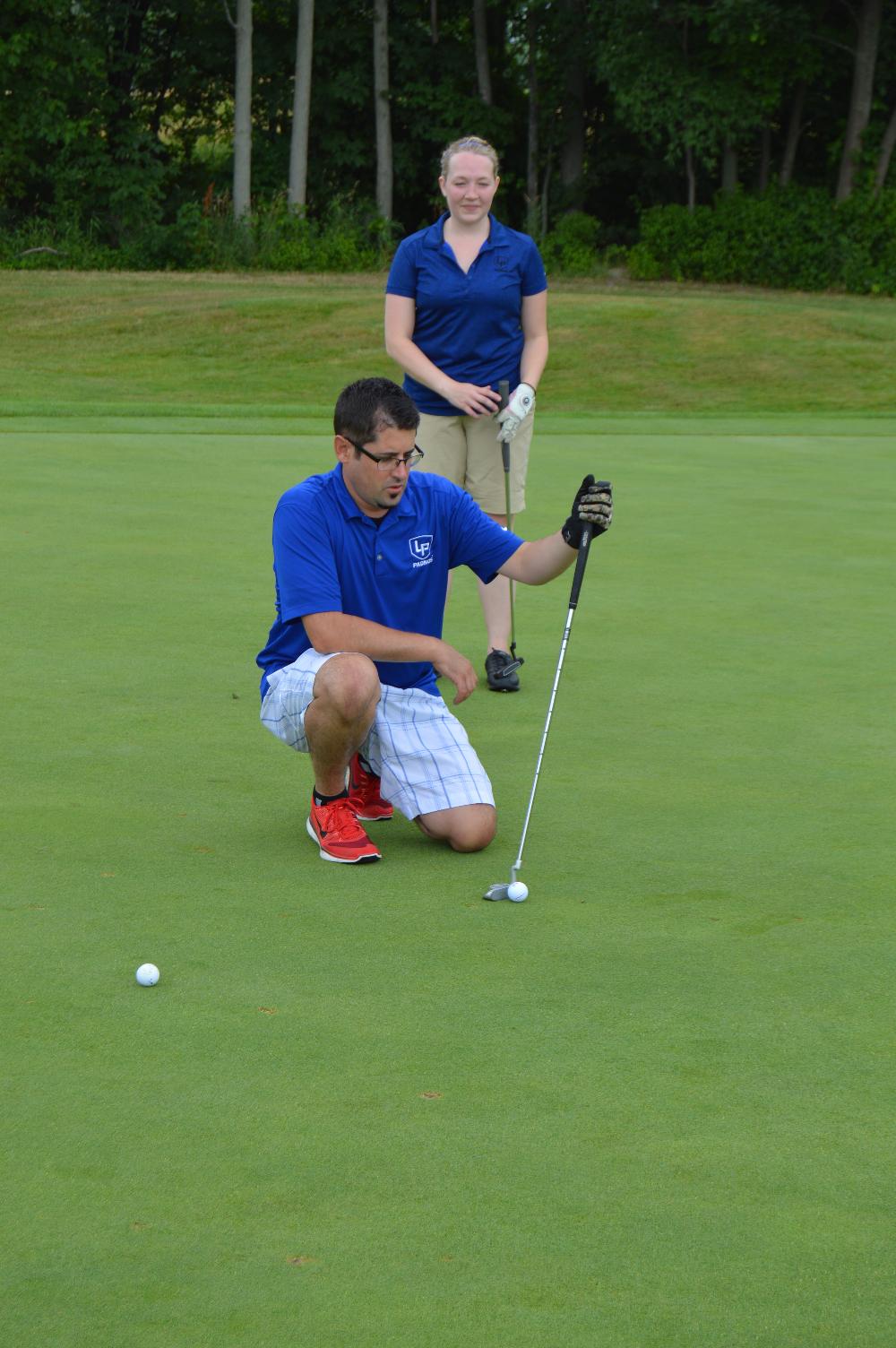 Alumni golfing at the Meadows Golf Course.